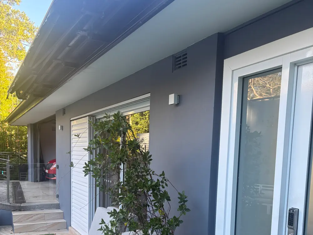 Clean rendered home exterior and glass after an AW house wash