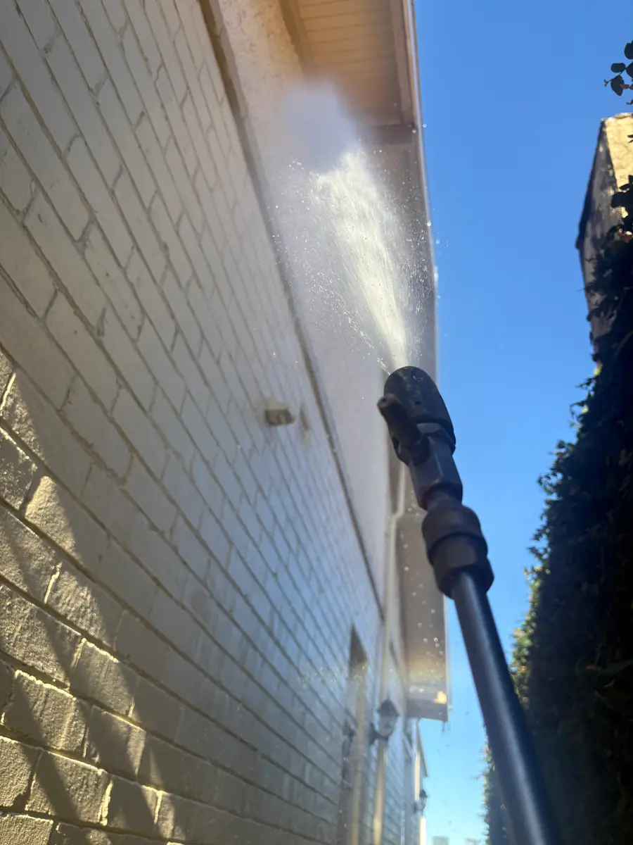 AW Pressure Washing soft washing a Sydney house exterior