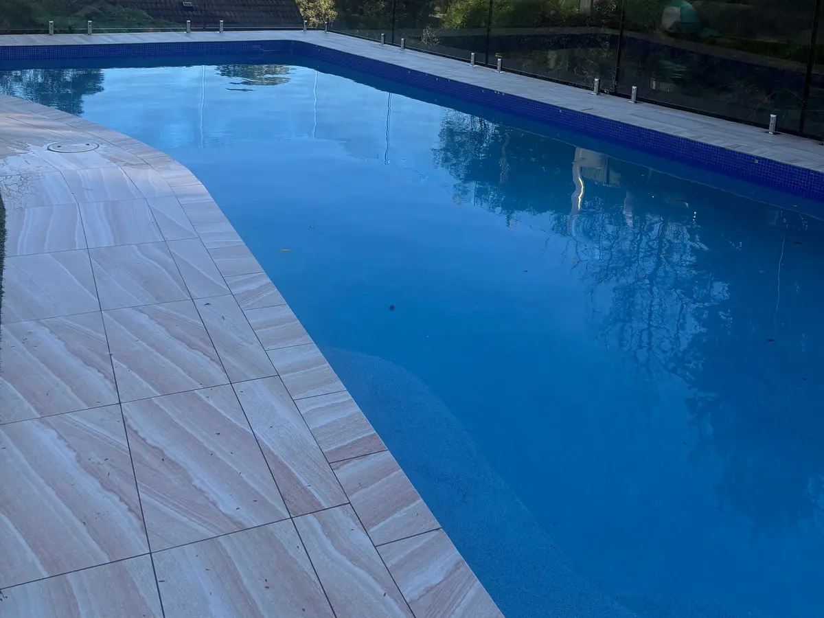 Clean sandstone pavers and pool coping after an AW pressure wash