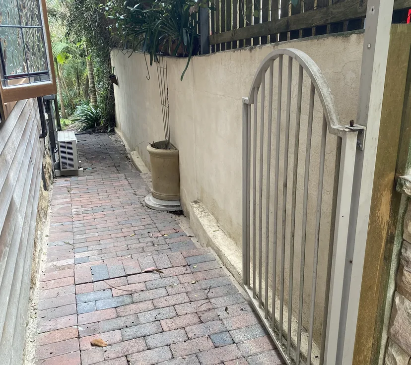 Brick side path after pressure cleaning, brick colour restored