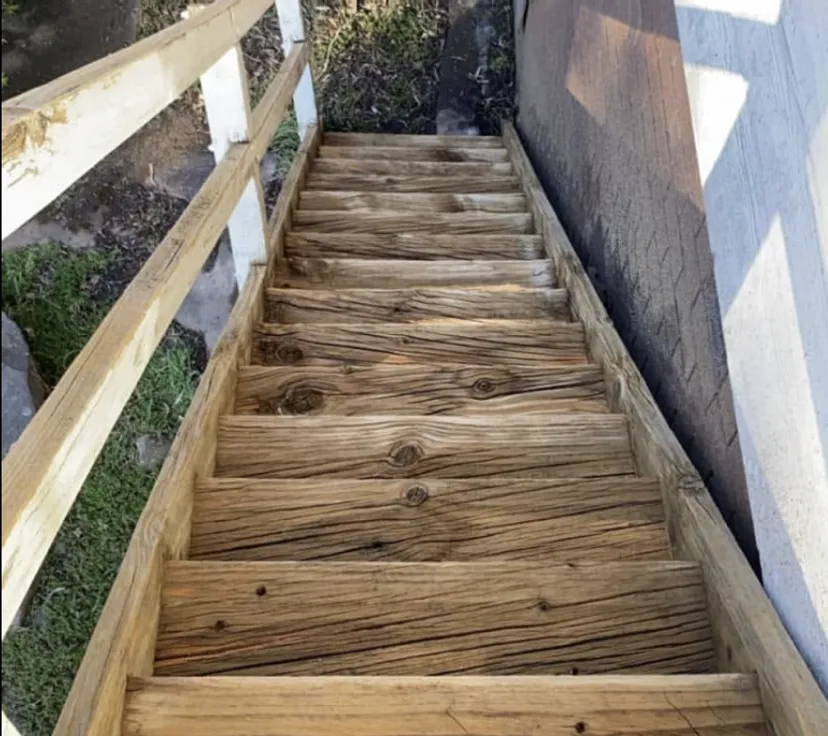 Timber staircase after pressure cleaning, natural wood grain restored
