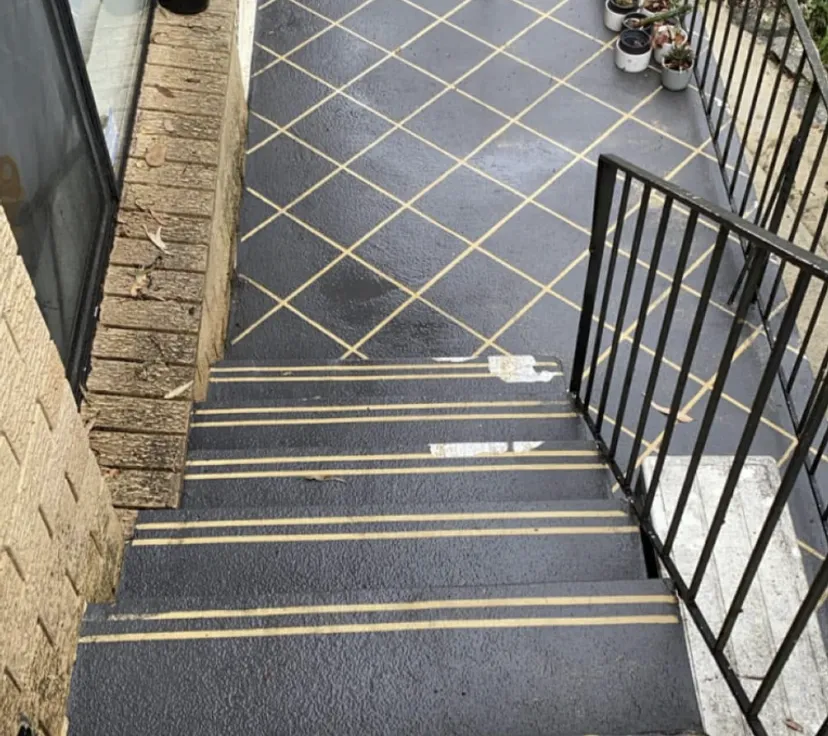 Tiled entry and stairs after pressure cleaning, mould and grime removed, pattern crisp